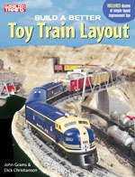 build a better toy train layout cover shows an o gauge layout