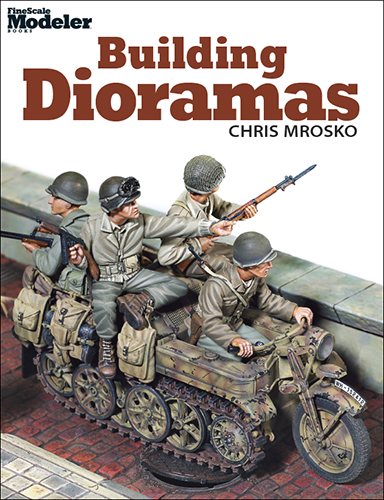 building dioramas shows a model or world war 2 german soldiers on a motorcycle half track