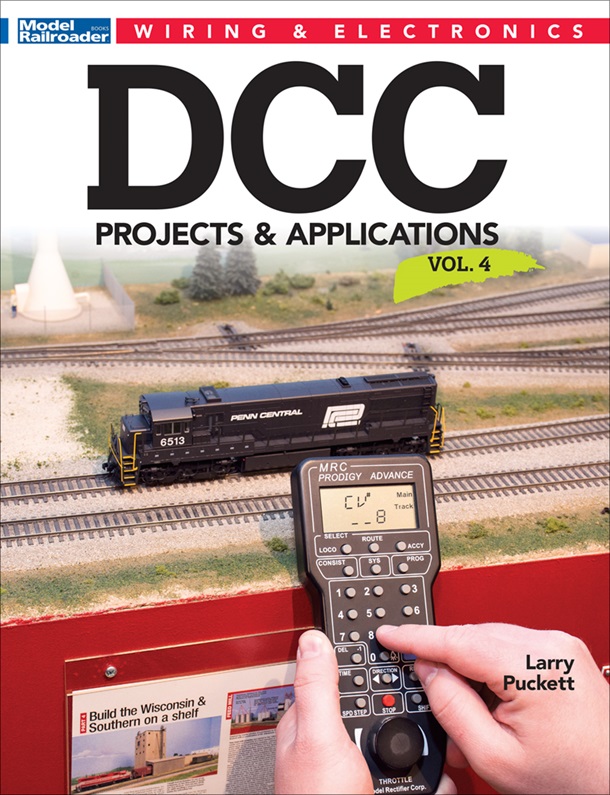 DCC projects and applications volume 4 cover showing a pair of hands holding a controller in front of a layout