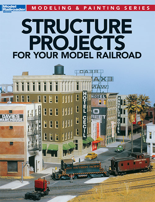 structure projects for your model railroad cover shows a HO layout showing a train by a group of buildings