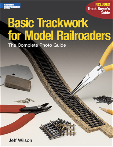 the cover shows a piece of HO track along with tools
